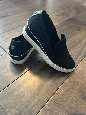 The WISHBONE Slip-On Wedge Sneakers in Black